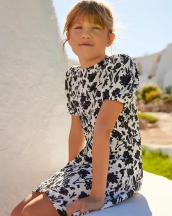 Vestido para niña en blanco y negro con mangas abullonadas y estampado floral