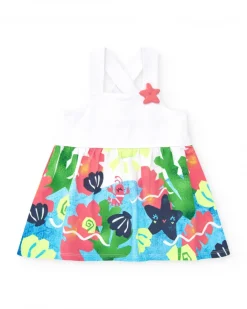 Vestido para niña en blanco con tirantes cruzados y falda floral